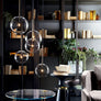 Lustre suspendu en forme de boule de verre - L'Atelier Imbert